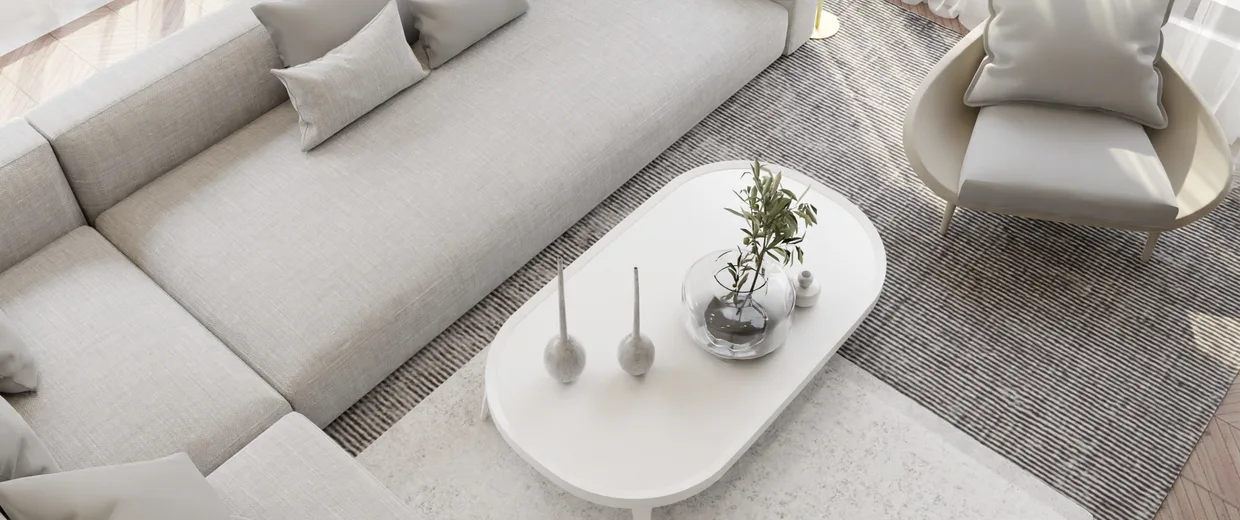Bright and cozy minimalist living room with beige sofa and modern decor.